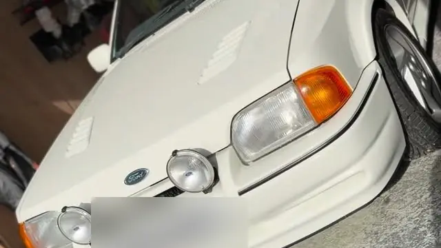A white Ford Escort RS Turbo in the Perfect Detail workshop