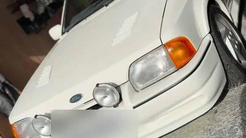 A white Ford Escort RS Turbo in the Perfect Detail workshop