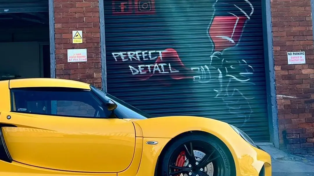 A Lotus Exige with a freshly finished custom paint job outside the Perfect Detail workshop