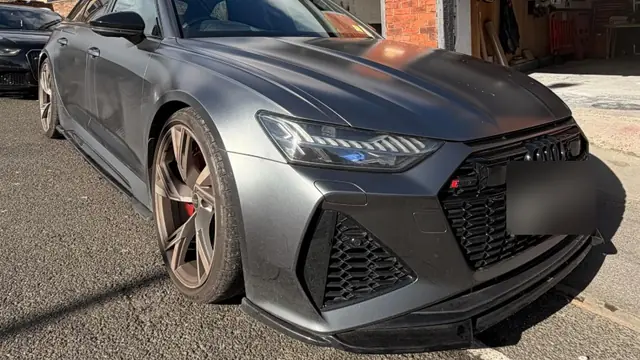 An Audi RS6 in matt grey outside the Perfect Detail workshop after rear quarter repair