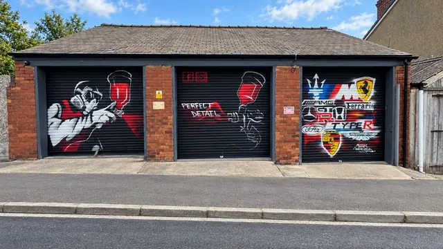The Perfect Detail workshop on Belmont Avenue, Balby, with graffiti-painted shutters
