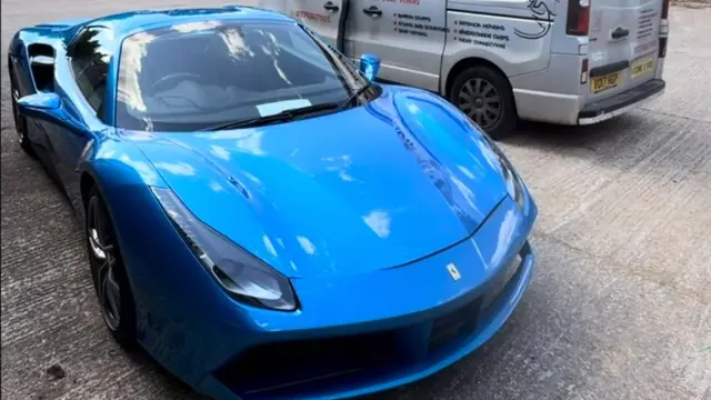 A blue Ferrari 488 Spider parked beside the Perfect Detail van